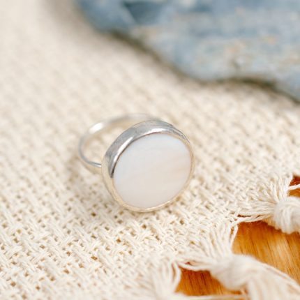 Sterling silver ring inset with a disc of white Mother of Pearl by Porth Jewellery