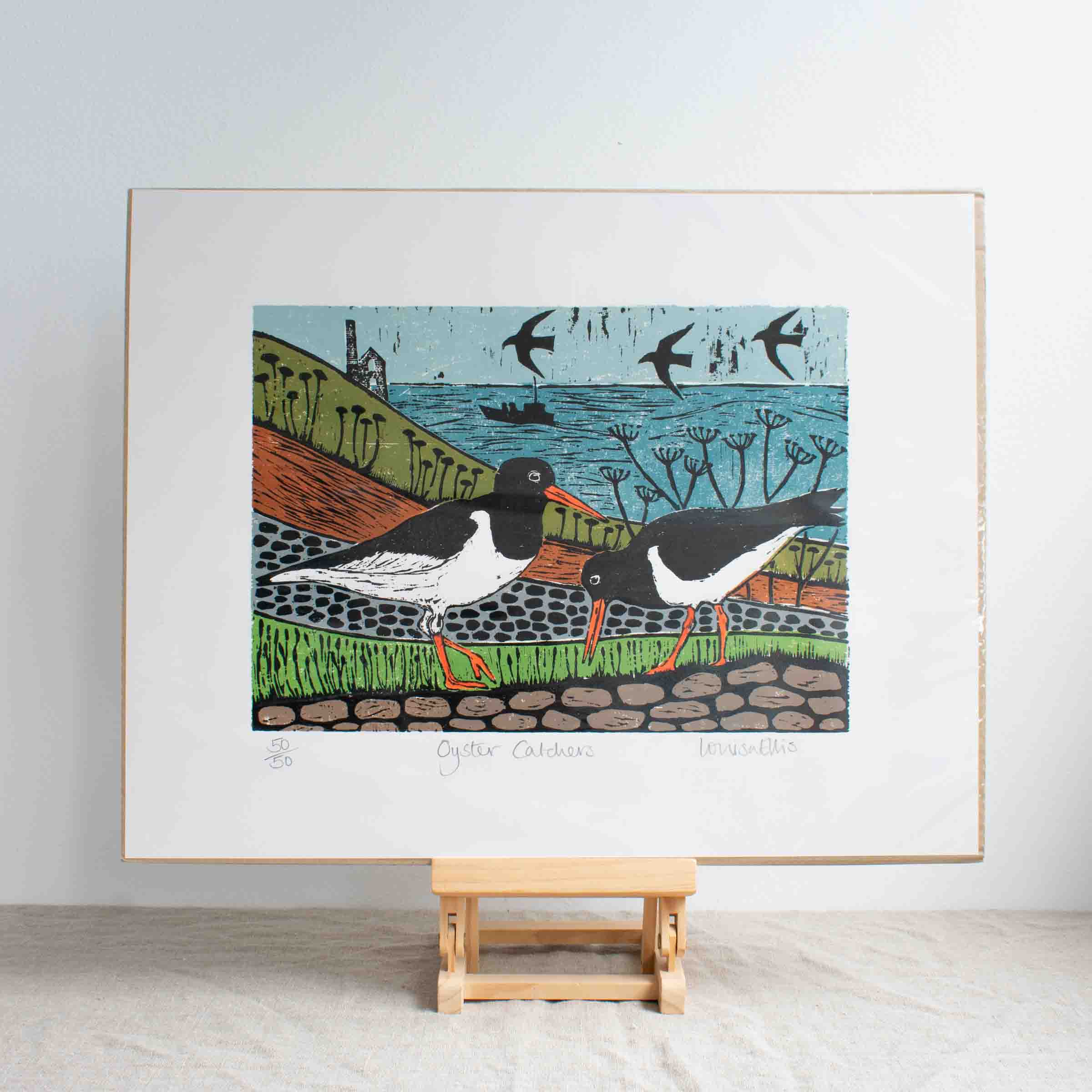 Woodcut print of two oystercatchers in a field with tin mine in background by Louisa Ellis