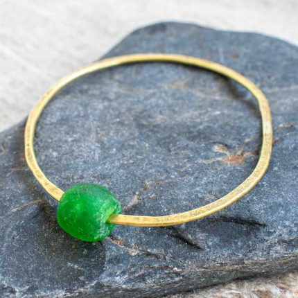 Brass bangle with green bottle bead by Sarah Drew