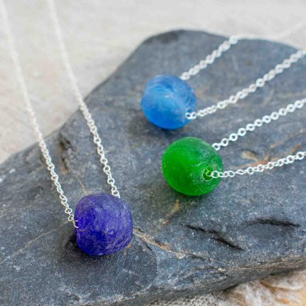 Three bottle beads on silver chains by Sarah Drew