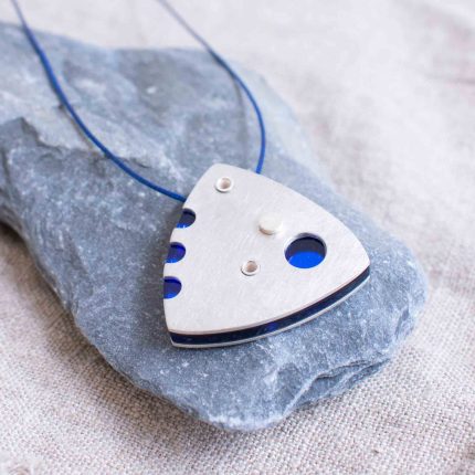 Blue perspex and pewter contemporary pendant on waxed blue cord by Ceciel Van Oevelen