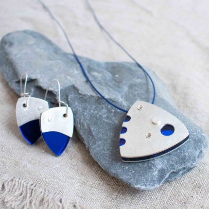 Pair of blue perspex and pewter contemporary drop earrings and matching pendant on waxed blue cord by Ceciel Van Oevelen