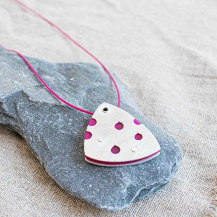 Pink perspex and pewter contemporary pendant on waxed pink cord by Ceciel Van Oevelen