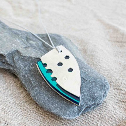 Teal perspex and pewter contemporary pendant on waxed grey cord by Ceciel Van Oevelen