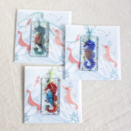 Group of three fused glass seahorse decorations of various colours with cards by Dreya Glass