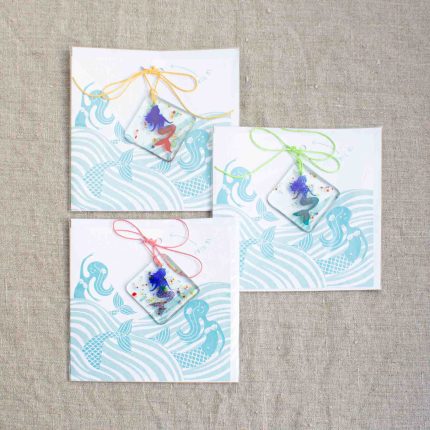 Group of three fused glass mermaid decorations in different colours with card by Dreya Glass