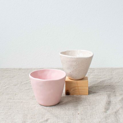 Pair of small ceramic beakers in cream and pink by Frances Spice