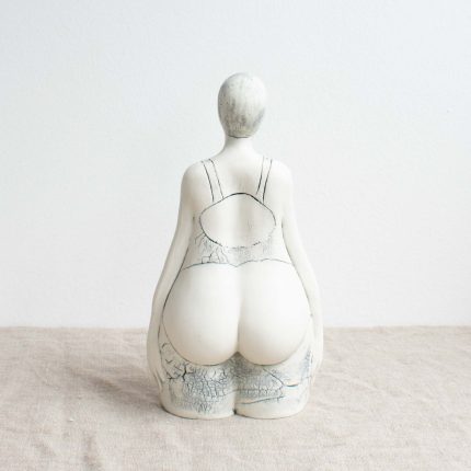 Back view of a porcelain sculpture of a bather by Nicky Stone