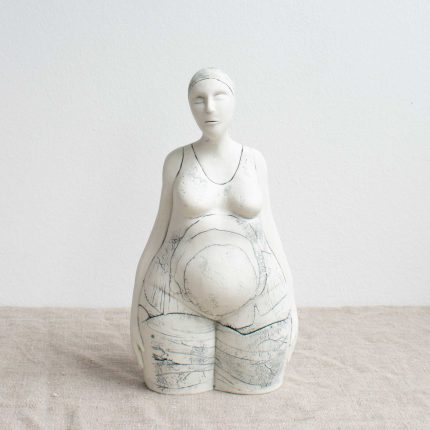 Front view of a porcelain sculpture of a bather by Nicky Stone