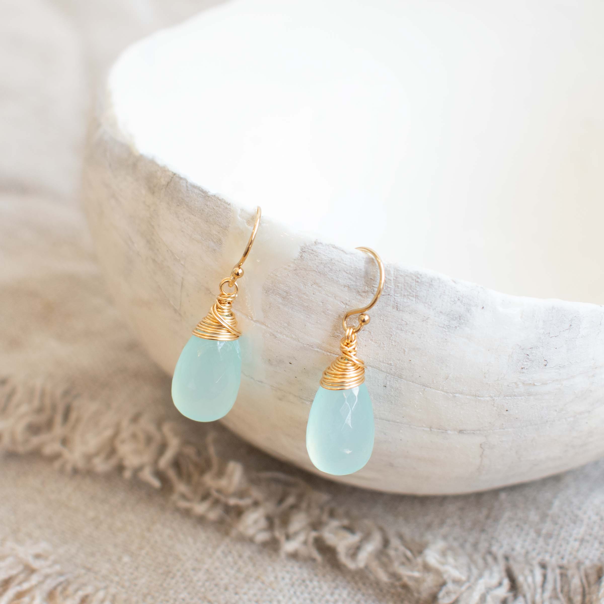 Pair of sea green chalcedony and gold filled wire wrapped drop earrings by Sarah de Larrinaga