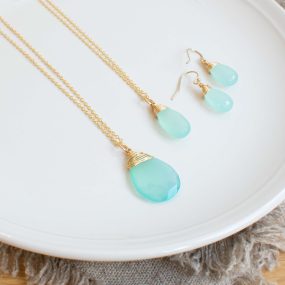 Two Sea Green Chalcedony And Gold Filled Wire Wrapped Pendants Of Different Sizes And A Pair Of Drop Earrings By Sarah De Larrinaga