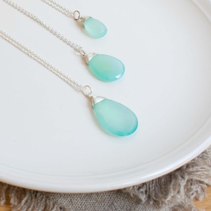 Three sea green chalcedony and silver pendants of different sizes by Sarah de Larrinaga