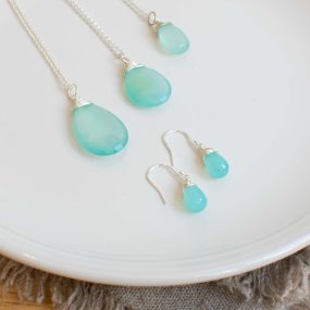 Three Sea Green Chalcedony And Silver Pendants Of Different Sizes And A Pair Of Small Drop Earrings By Sarah De Larrinaga