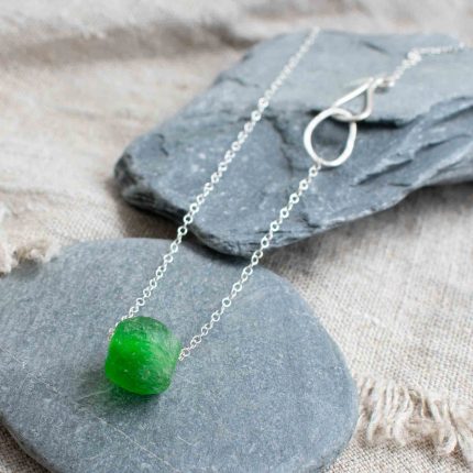 Green bottle bead on a silver chain by Sarah Drew