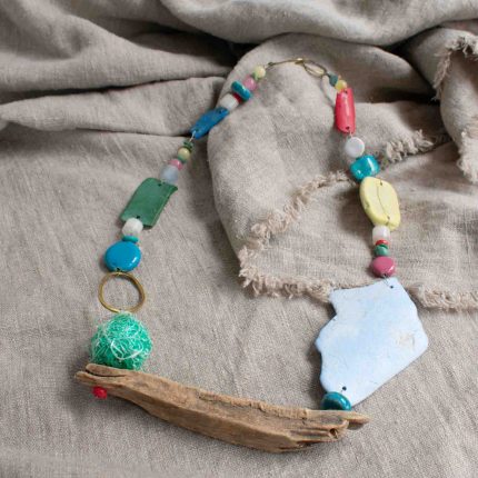 Statement necklace made of beach plastic, driftwood and brass by Sarah Drew