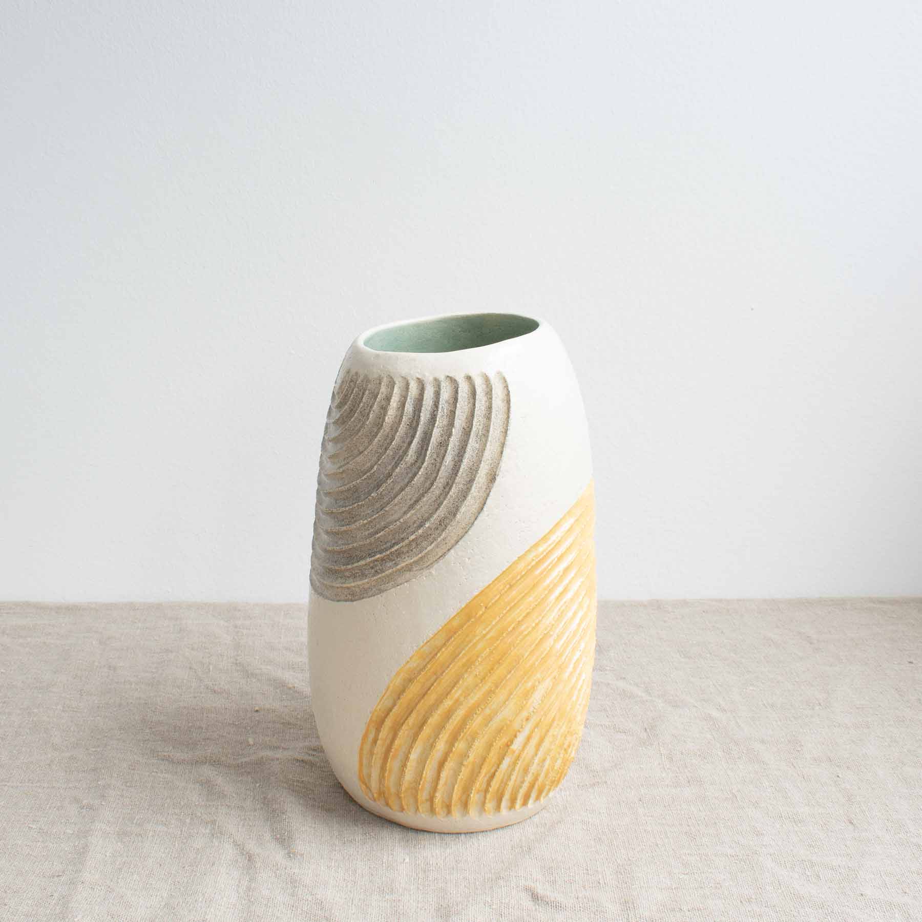 Large stoneware vase with grey and yellow carved metal and turquoise interior by Sarah Sullivan