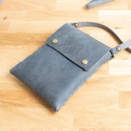 Grey leather cross body bag handcrafted by Wild Origin