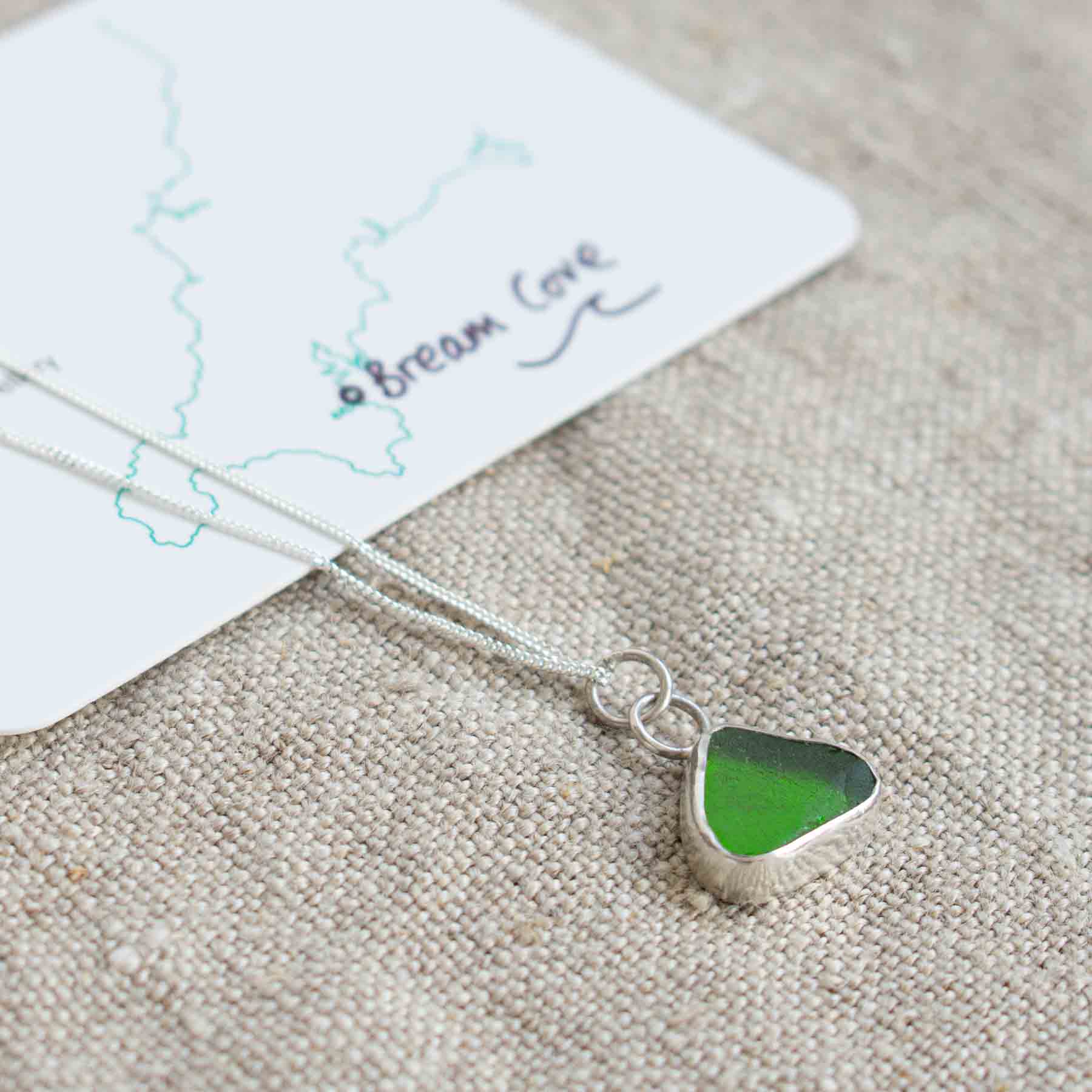 Piece of green seaglass set into silver on a chain by Porth Jewellery