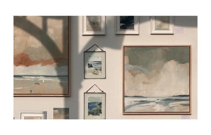 Seascape Paintings By Aimee Willcock Hanging On A Wall With Shadow Of A Tree