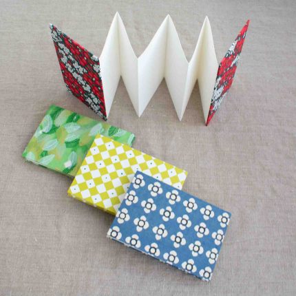 Group of four handcrafted concertina books with patterned paper cover by Books n Boxes