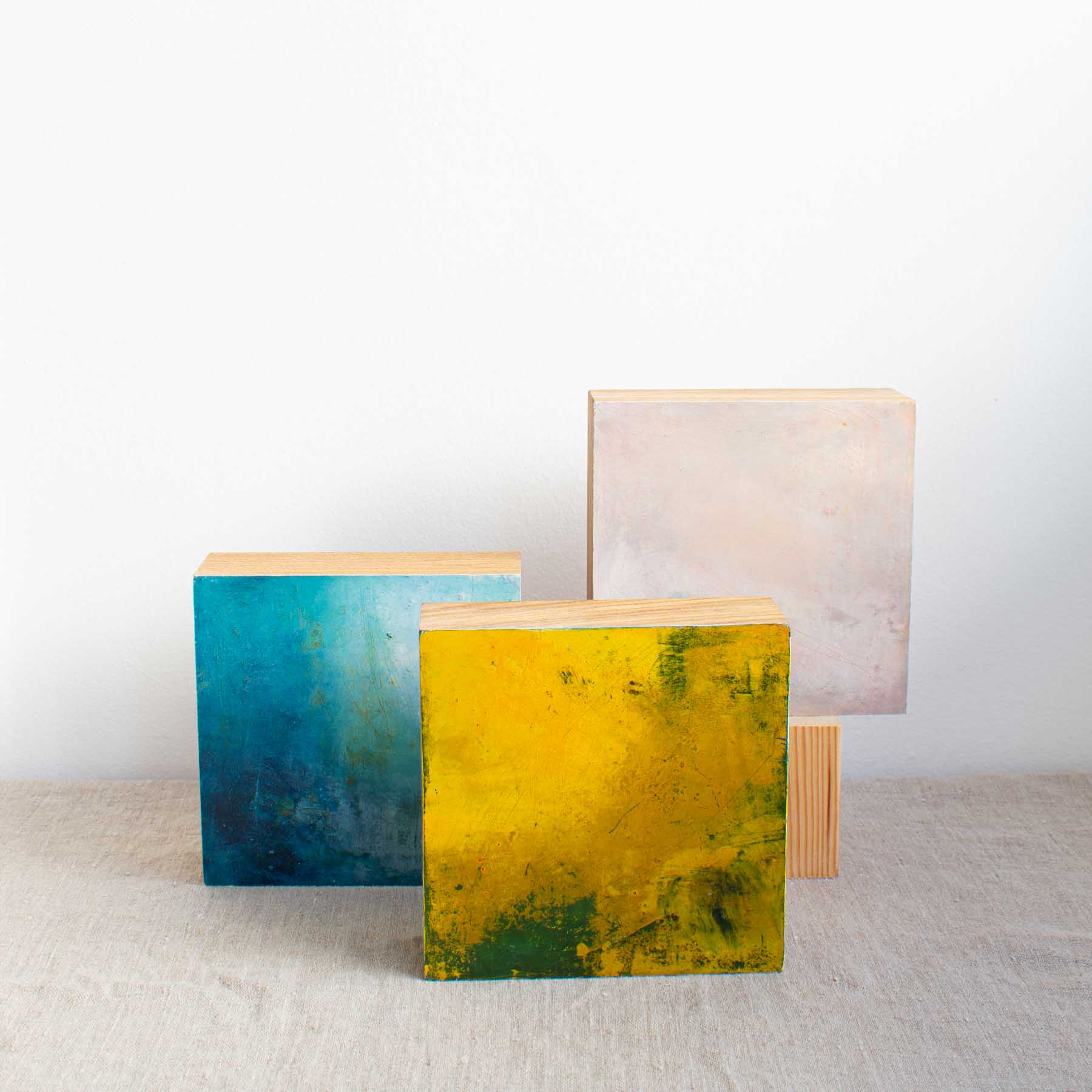 Group of three original oil and cold wax abstract artworks painted directly onto solid oak blocks by Helen Leaver