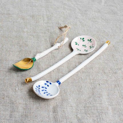 Trio of different long handled porcelain spoons by Frances Spice