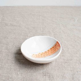 Small Porcelain Bowl With Pink Design And Gold Dots On A Linen Tablecloth By Frances Spice