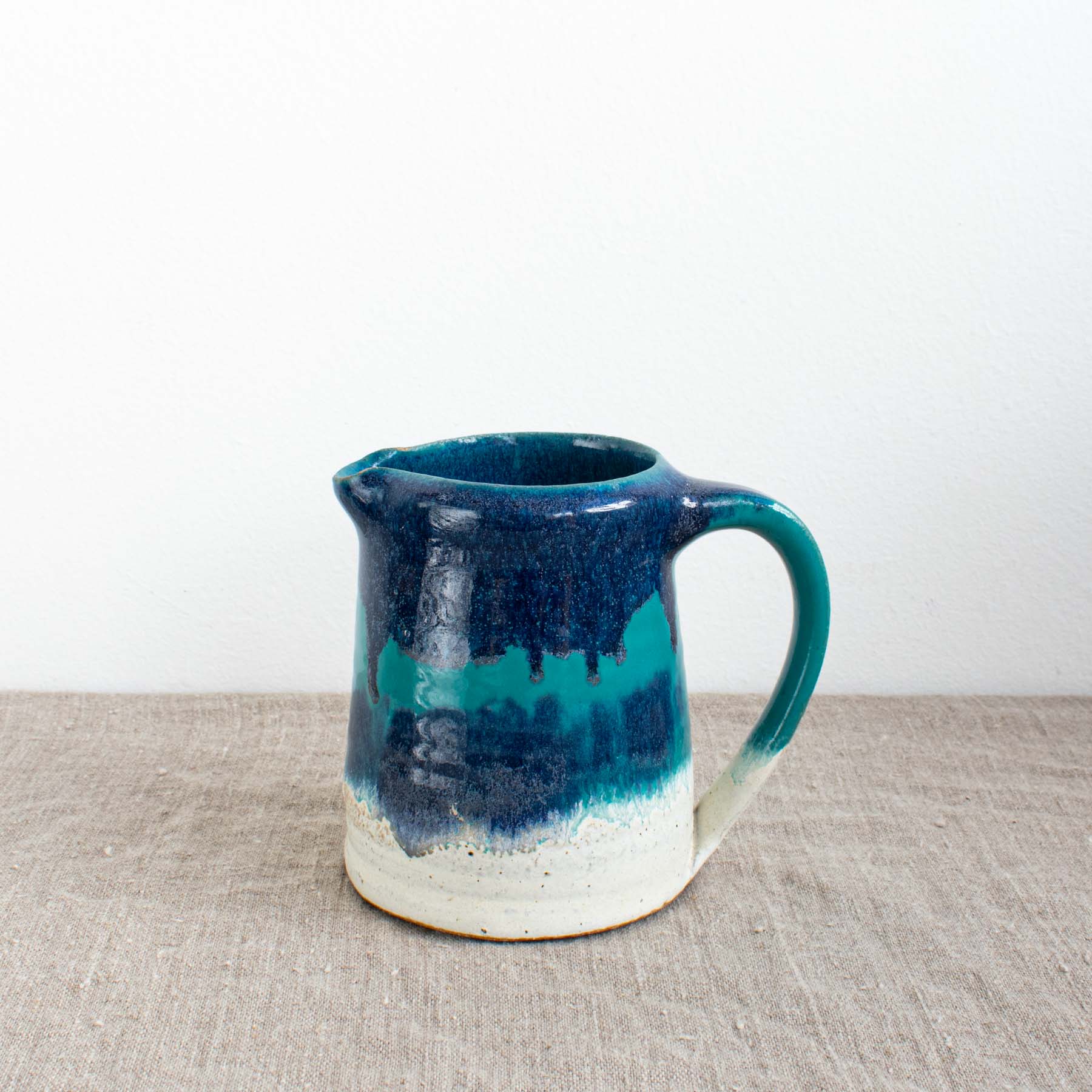 Blue glazed handmade ceramic jug